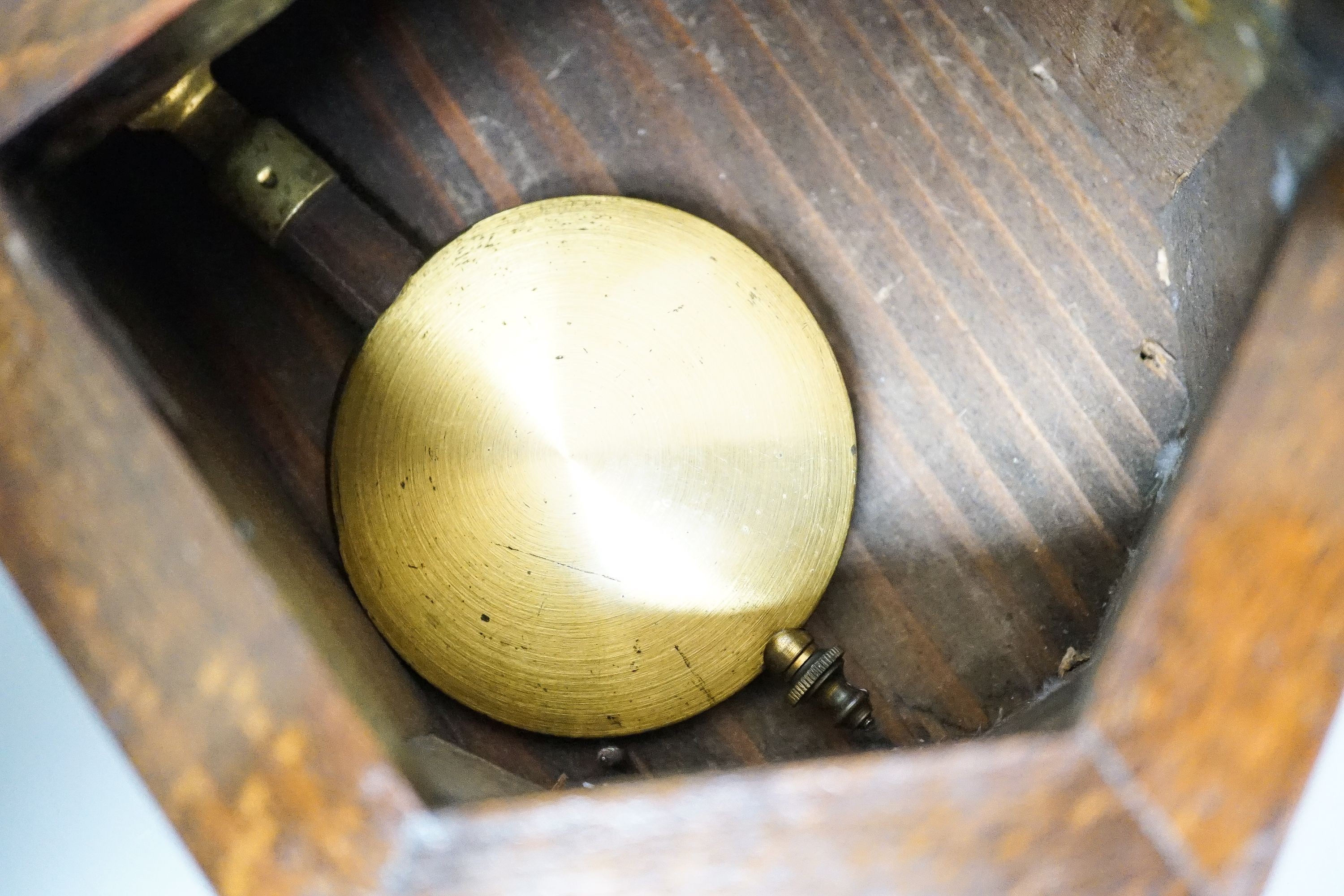 A small late 19th century beech drop dial timepiece with key and pendulum 31cm